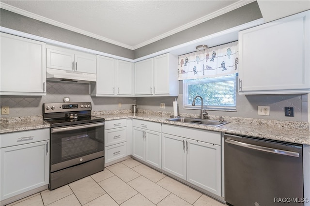 kitchen featuring ornamental molding, stainless steel appliances, sink, light tile patterned floors, and white cabinets