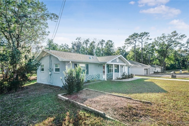 ranch-style house with a garage and a front lawn