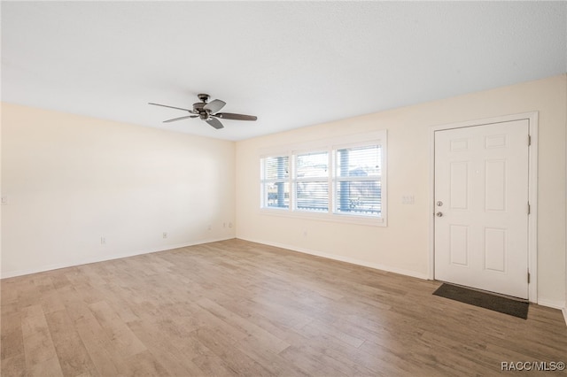 entrance foyer featuring ceiling fan and light hardwood / wood-style flooring