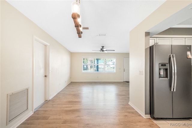 kitchen with white cabinets, ceiling fan, light hardwood / wood-style floors, and stainless steel fridge with ice dispenser