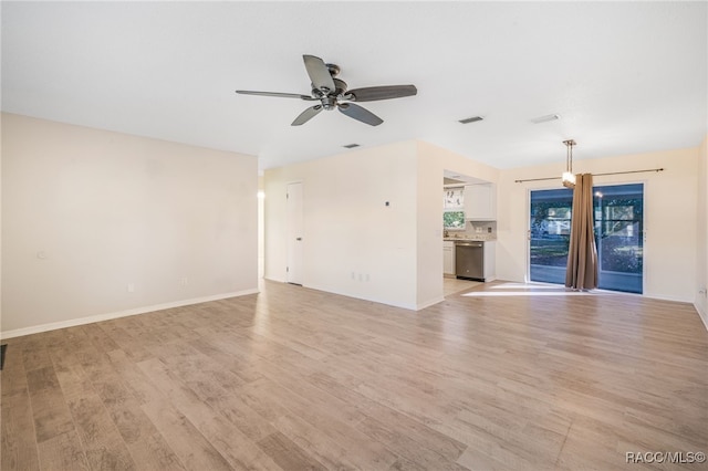 unfurnished living room featuring light hardwood / wood-style floors and ceiling fan