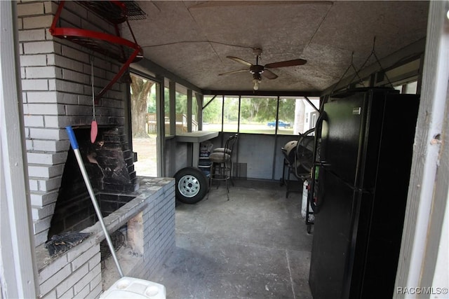 unfurnished sunroom with a ceiling fan