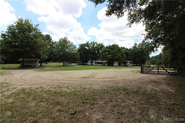 view of property's community featuring a yard