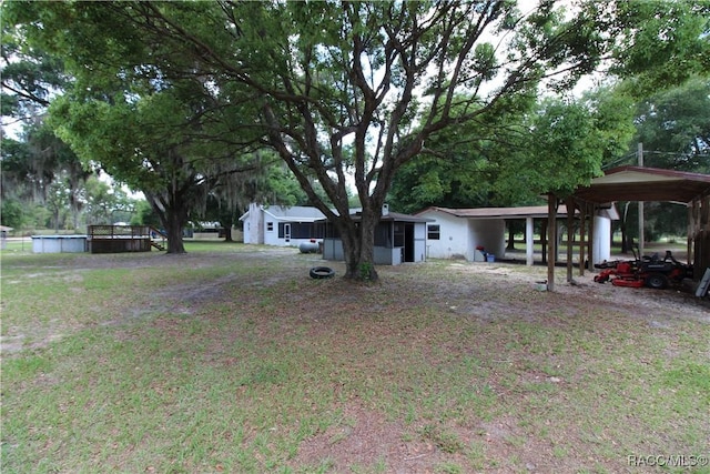 view of yard with a carport