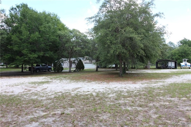 view of yard with a carport