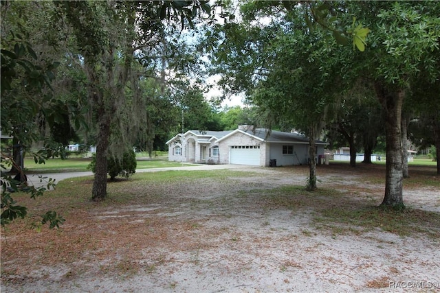 exterior space featuring a garage and driveway