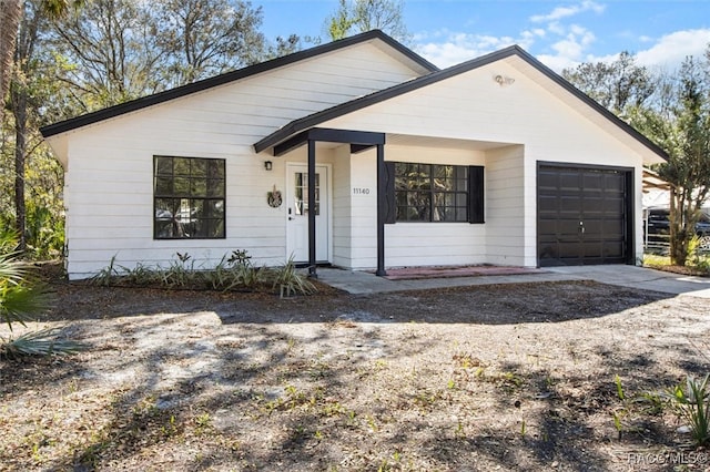 single story home featuring driveway and an attached garage