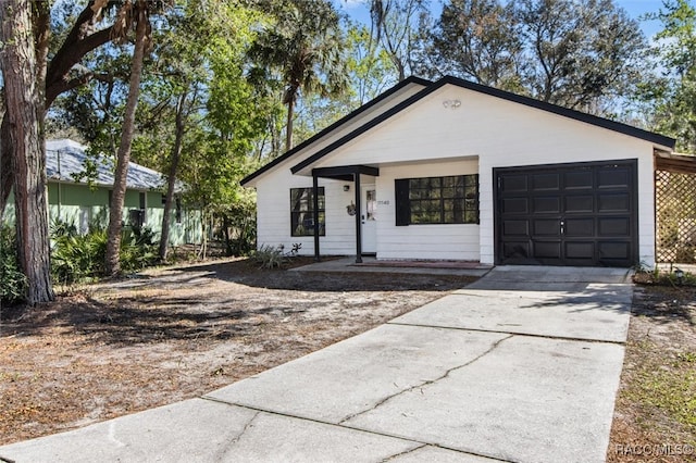 view of front of house with an attached garage and concrete driveway