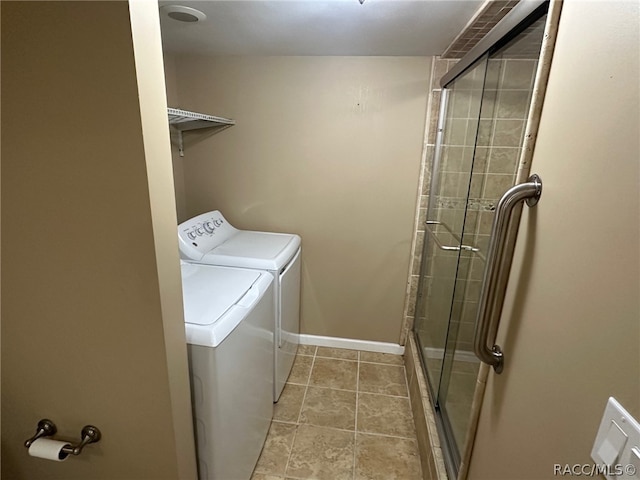 washroom with washer and dryer