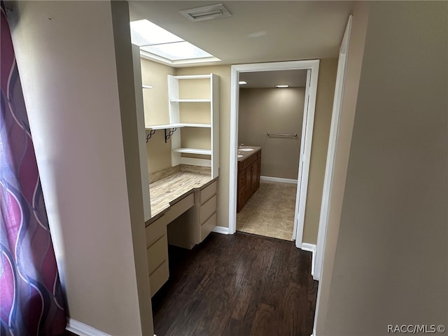 bathroom with hardwood / wood-style floors