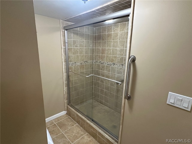 bathroom featuring tile patterned flooring and walk in shower