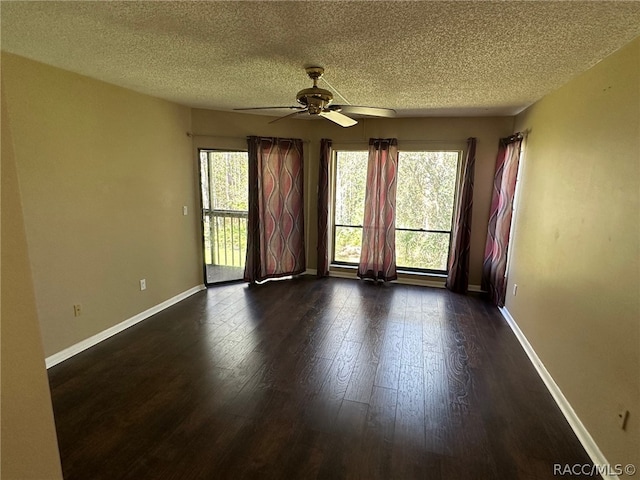 unfurnished room with ceiling fan, dark wood-type flooring, and a textured ceiling