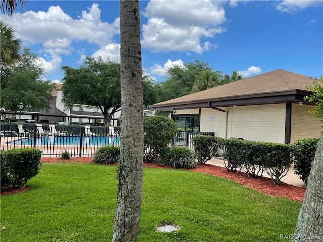 view of yard featuring a community pool