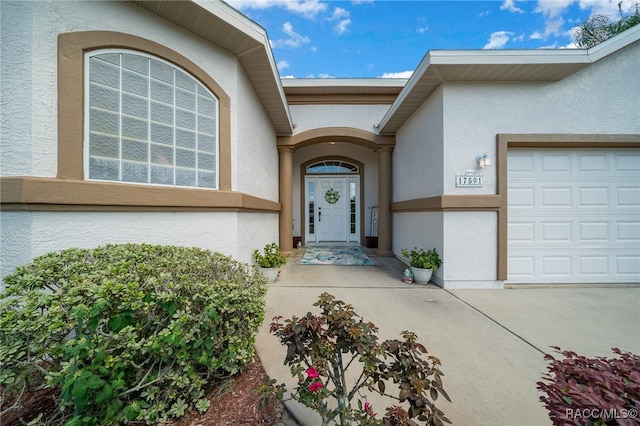 property entrance with a garage