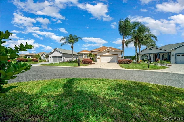 ranch-style house with a front yard and a garage