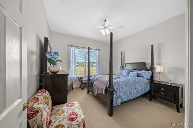 bedroom featuring light colored carpet and ceiling fan