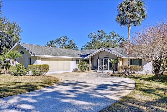 single story home with a garage and a front lawn