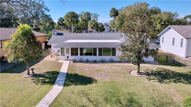 single story home featuring a front yard