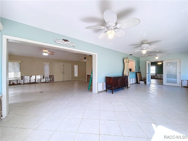 unfurnished living room featuring light tile patterned floors