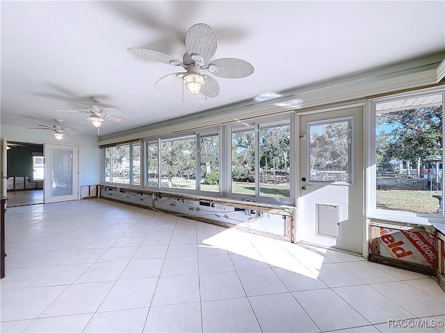 unfurnished sunroom featuring a healthy amount of sunlight