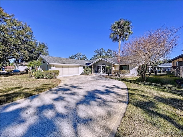 single story home with a garage and a front lawn