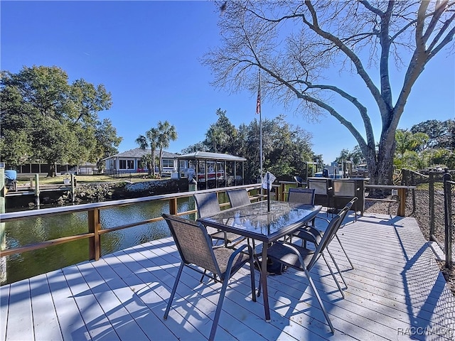 wooden deck featuring a water view