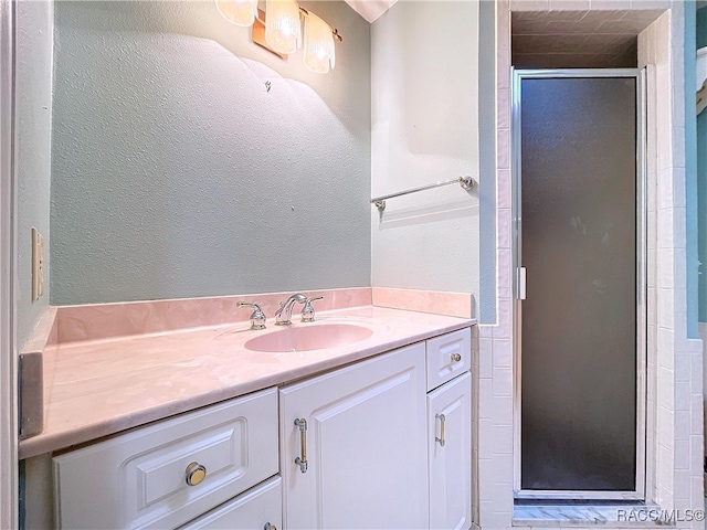 bathroom with vanity and an enclosed shower