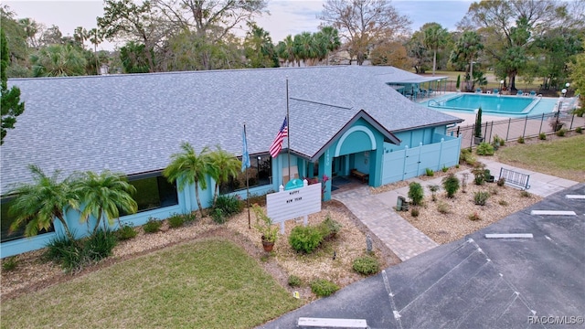 view of front facade with a community pool