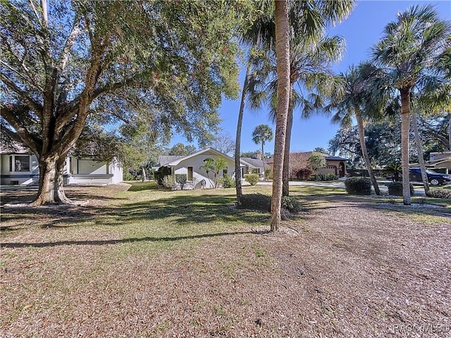 ranch-style home featuring a front lawn