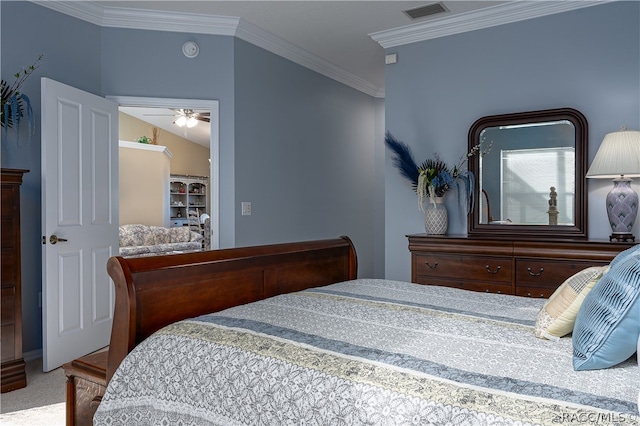 carpeted bedroom featuring crown molding and vaulted ceiling