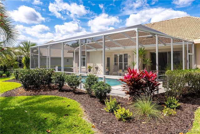 back of house featuring a lanai