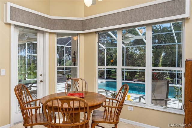 dining area with tile patterned floors and a healthy amount of sunlight