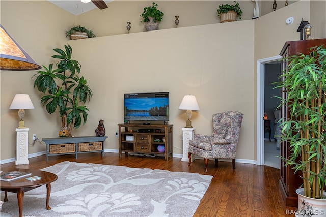 living room with hardwood / wood-style flooring, high vaulted ceiling, and ceiling fan