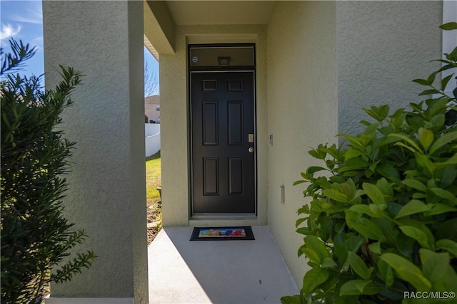 3525 N Burroughs Path, Beverly Hills, FL 34465 - view of exterior entry with stucco siding