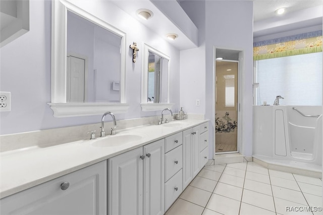 bathroom featuring tile patterned flooring, vanity, separate shower and tub, and a wealth of natural light