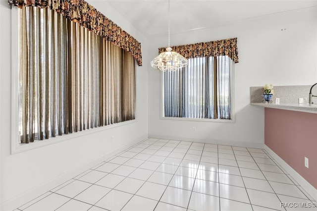 unfurnished dining area featuring light tile patterned floors and an inviting chandelier