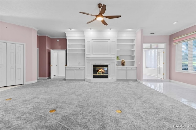 unfurnished living room with light colored carpet, ceiling fan, and crown molding