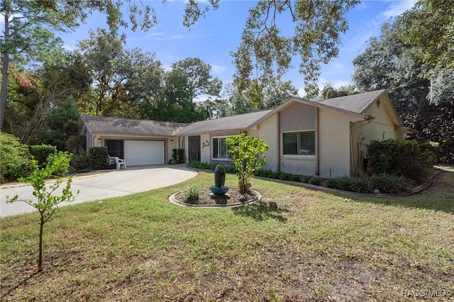 ranch-style house featuring a front yard and a garage