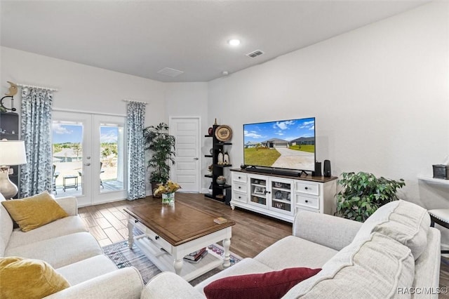 living room with wood finished floors, recessed lighting, french doors, and visible vents