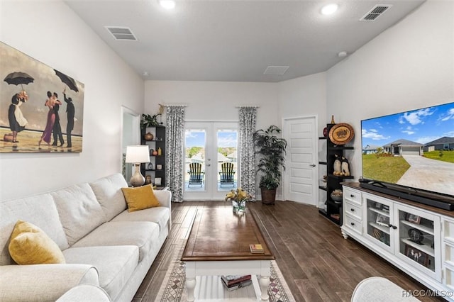 living area featuring visible vents and dark wood-style flooring