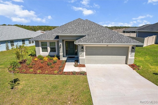 single story home with concrete driveway, a front yard, roof with shingles, stucco siding, and a garage