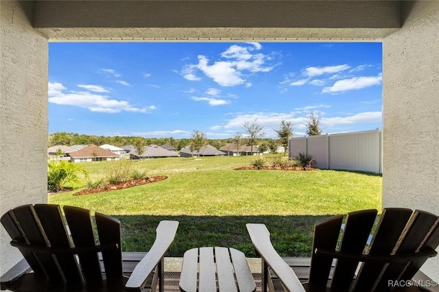 view of yard featuring a residential view and fence