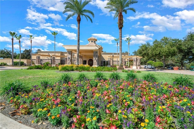 surrounding community with a lawn and a pergola