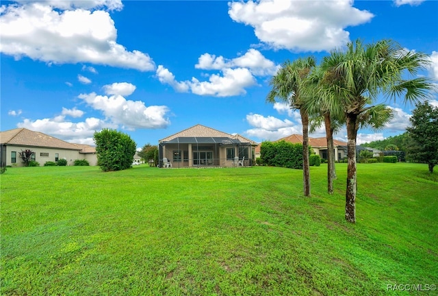 view of yard with a lanai