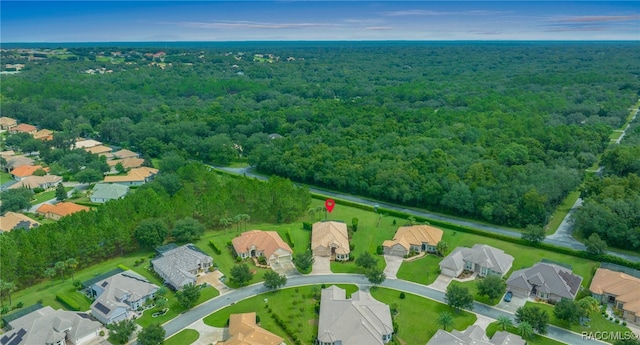 aerial view with a residential view and a wooded view