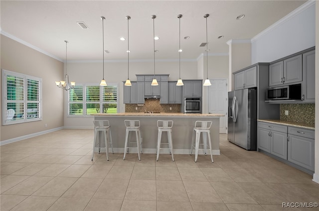 kitchen featuring visible vents, a chandelier, light tile patterned floors, gray cabinets, and appliances with stainless steel finishes