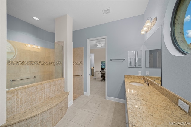 bathroom featuring ceiling fan, tile patterned flooring, vanity, and tiled shower