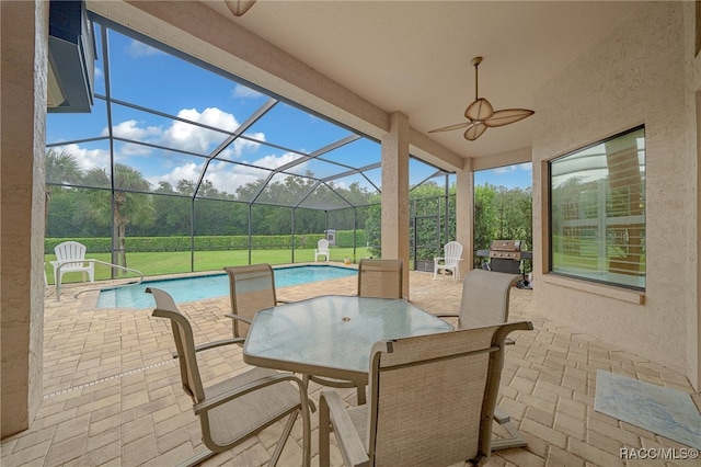 view of patio / terrace featuring glass enclosure, a ceiling fan, outdoor dining area, an outdoor pool, and a grill