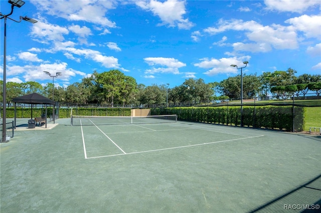 view of tennis court with a gazebo