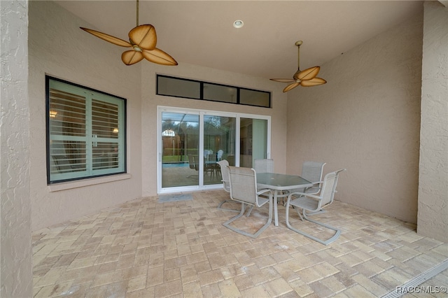 view of patio / terrace featuring outdoor dining area and ceiling fan